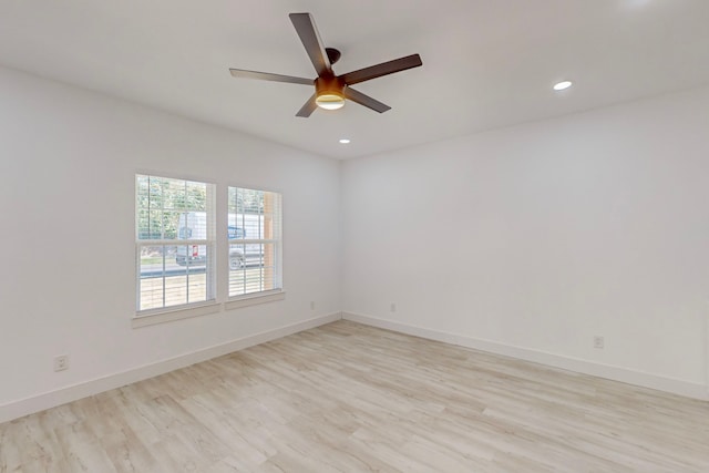 empty room featuring light wood-type flooring and ceiling fan