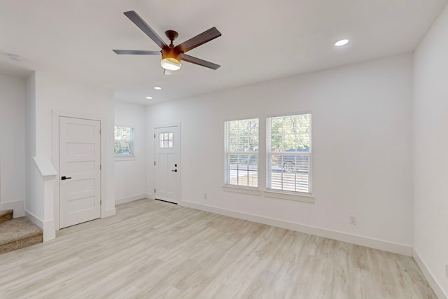 entrance foyer featuring light wood-type flooring and ceiling fan