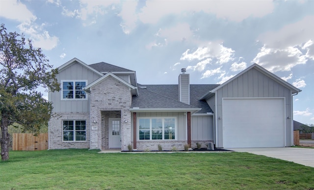 view of front of property with a garage and a front lawn