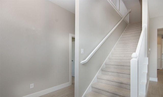 stairs with hardwood / wood-style flooring