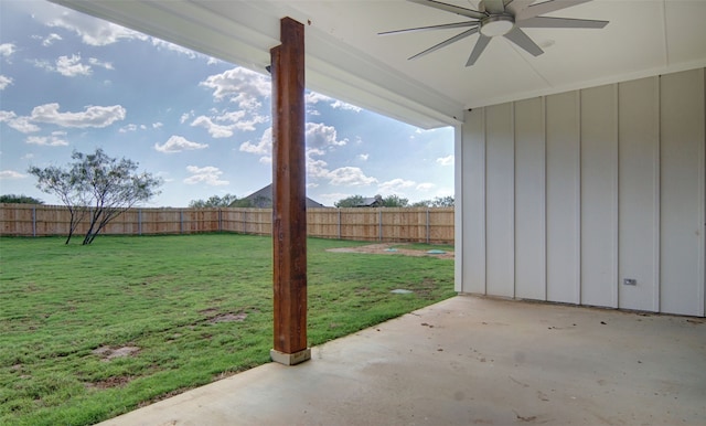 view of yard featuring a patio and ceiling fan