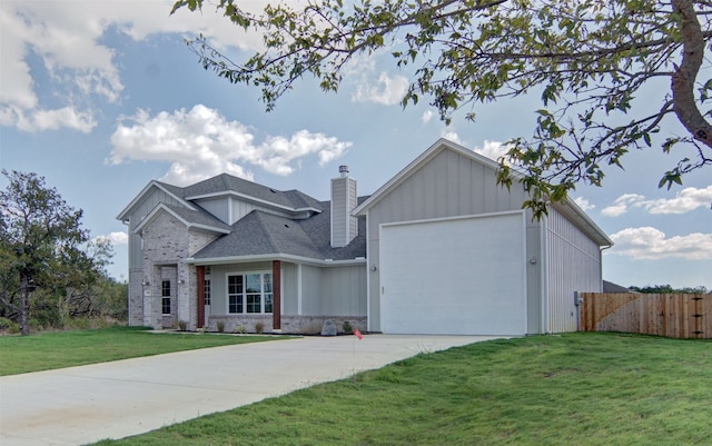 view of front facade featuring a front yard and a garage