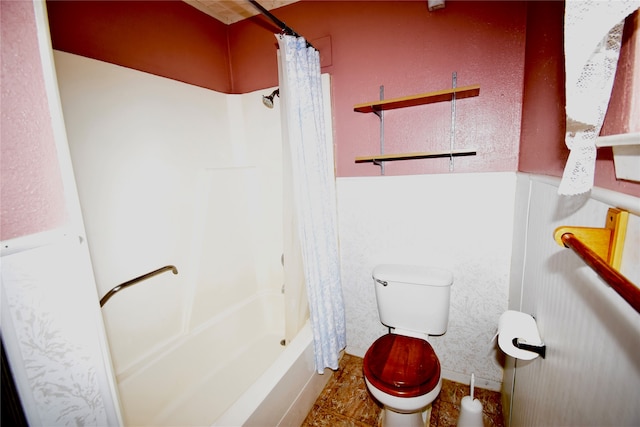 bathroom featuring toilet and shower / bathtub combination with curtain