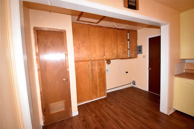 clothes washing area featuring cabinets, electric panel, hookup for a washing machine, dark wood-type flooring, and hookup for an electric dryer