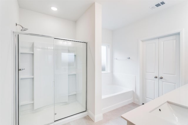 bathroom featuring visible vents, vanity, a shower stall, a bath, and recessed lighting