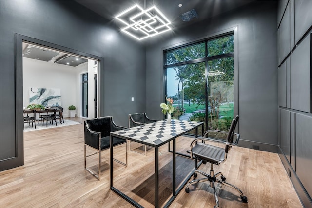 office with light hardwood / wood-style floors