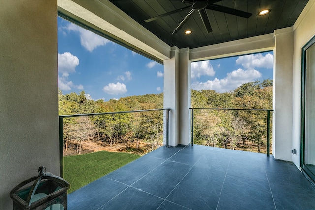 exterior space featuring ceiling fan