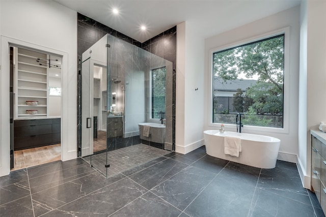 bathroom with vanity and plus walk in shower