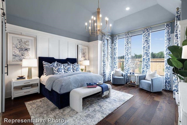 bedroom with dark wood-type flooring, a notable chandelier, and lofted ceiling