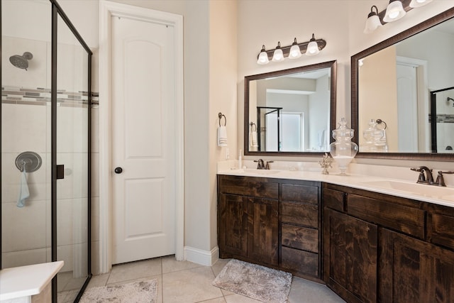 bathroom featuring vanity, walk in shower, and tile patterned flooring