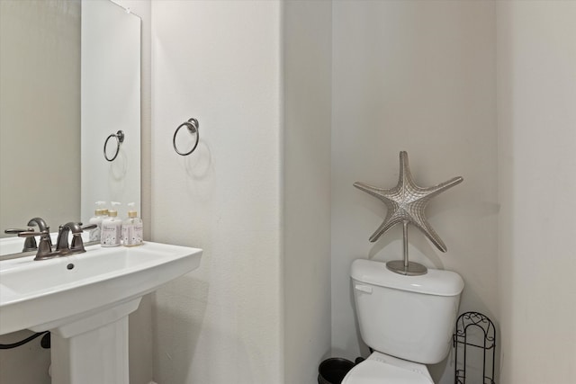 bathroom with sink and toilet