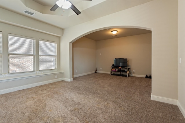 spare room with carpet floors and ceiling fan