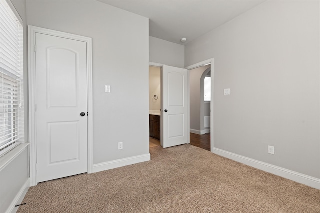 unfurnished bedroom featuring carpet floors