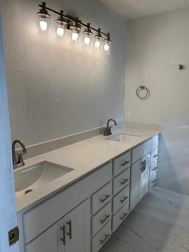 bathroom featuring vanity and a textured ceiling