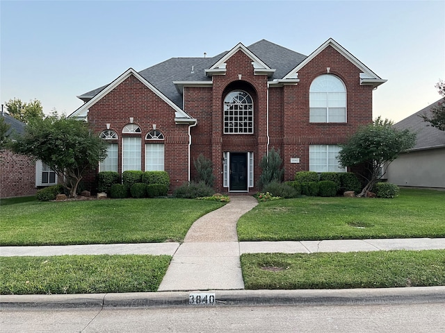 view of property featuring a front yard