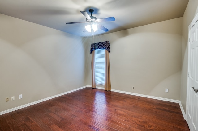 unfurnished room featuring ceiling fan and dark hardwood / wood-style flooring