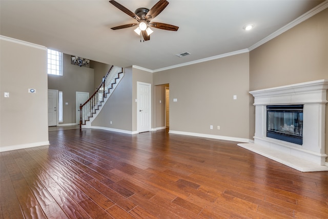 unfurnished living room with ceiling fan, crown molding, and hardwood / wood-style floors