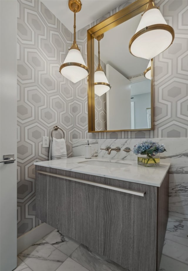 bathroom with vanity and marble finish floor