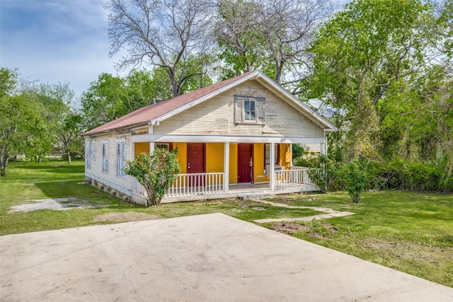 bungalow-style home with a porch and a front yard