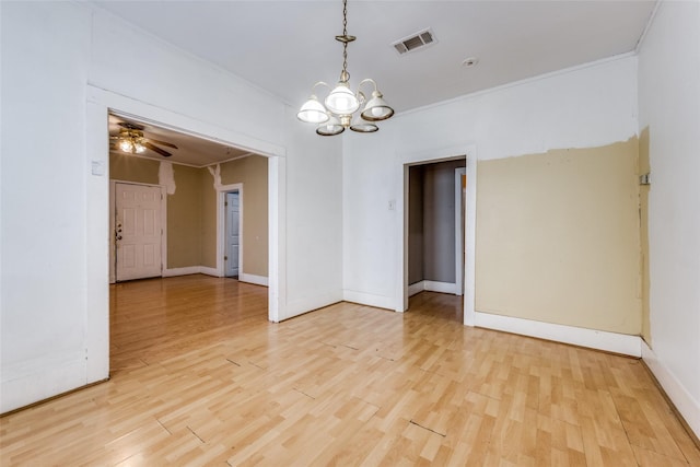 spare room with light hardwood / wood-style floors, crown molding, and ceiling fan with notable chandelier