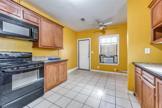 kitchen featuring cooling unit, ceiling fan, black appliances, and light tile patterned floors