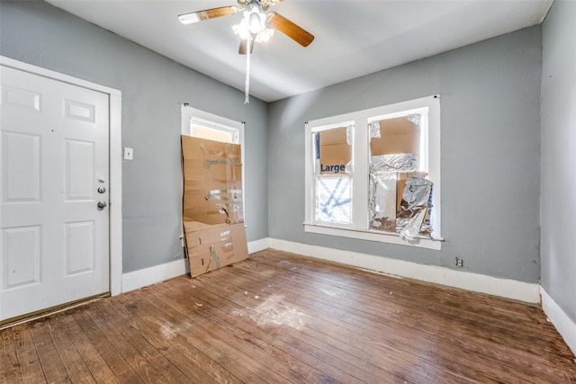 foyer featuring wood-type flooring and ceiling fan