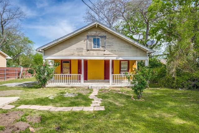 bungalow-style house with a porch and a front lawn