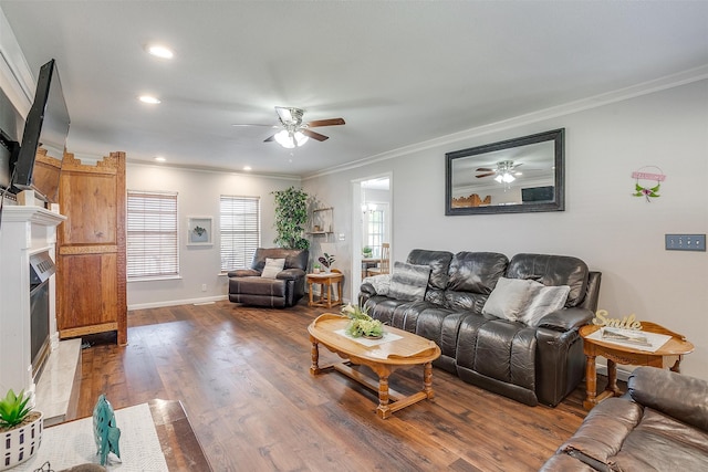 living room featuring ornamental molding, hardwood / wood-style flooring, and ceiling fan