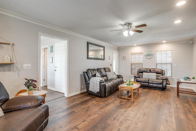 living room featuring ceiling fan, ornamental molding, and dark hardwood / wood-style flooring