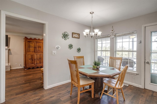 dining room featuring an inviting chandelier, dark hardwood / wood-style floors, and a wealth of natural light