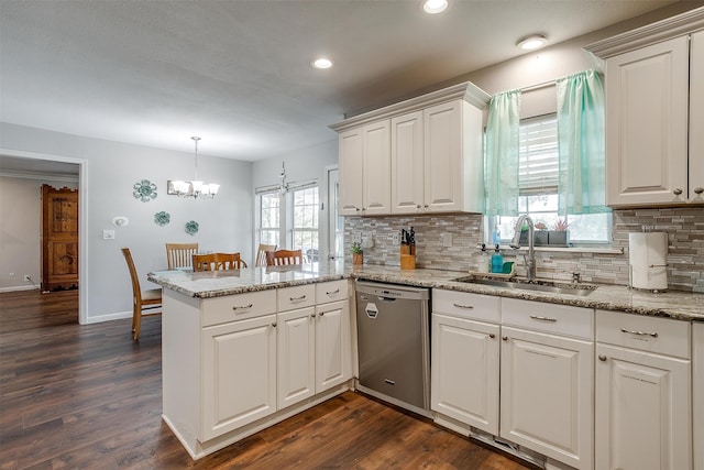 kitchen featuring sink, dishwasher, white cabinets, and dark wood-type flooring