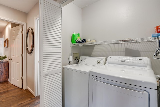 laundry room featuring dark hardwood / wood-style floors and separate washer and dryer