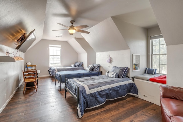 bedroom featuring ceiling fan, a textured ceiling, lofted ceiling, and dark hardwood / wood-style floors