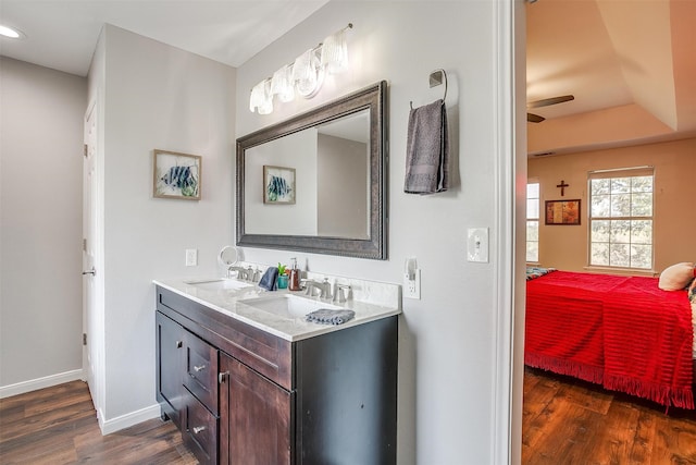 bathroom with vanity, hardwood / wood-style flooring, and ceiling fan