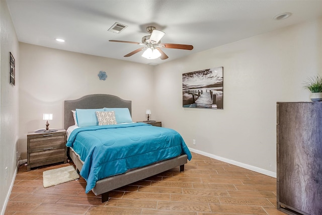 bedroom with ceiling fan and light hardwood / wood-style flooring