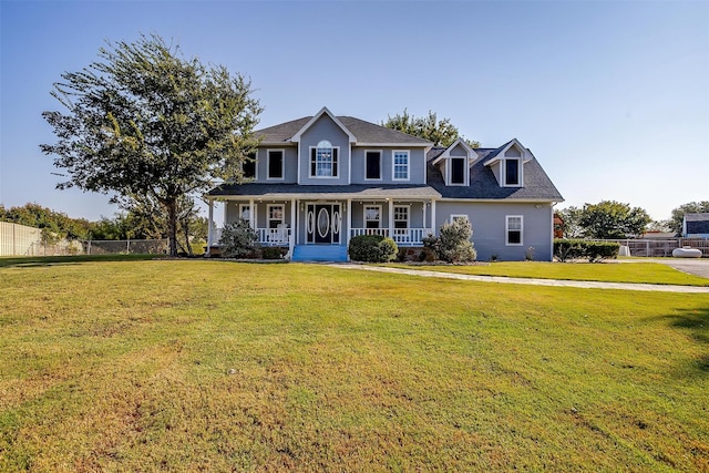 view of front of house featuring covered porch and a front lawn