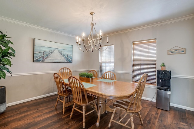 dining area with dark wood-type flooring, crown molding, and a chandelier