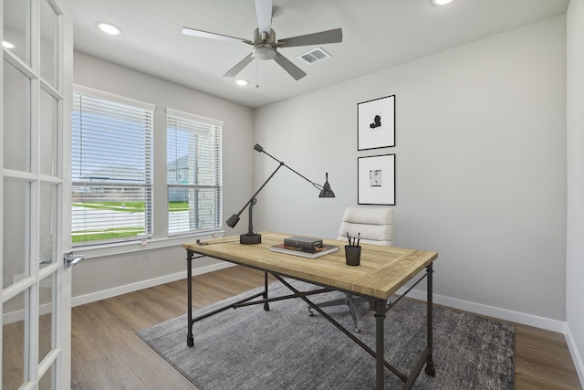 home office featuring french doors, hardwood / wood-style floors, a healthy amount of sunlight, and ceiling fan