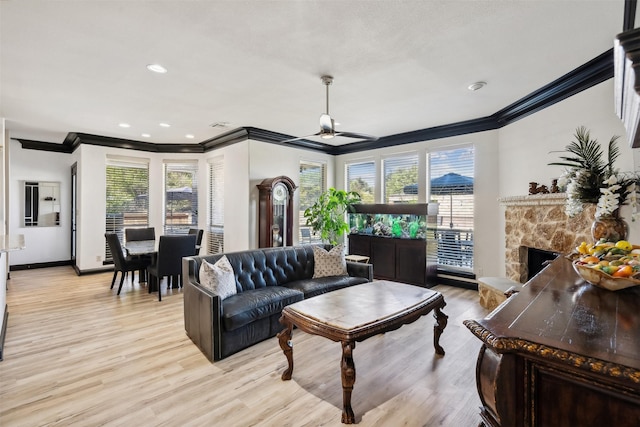 living room with a wealth of natural light and light hardwood / wood-style floors