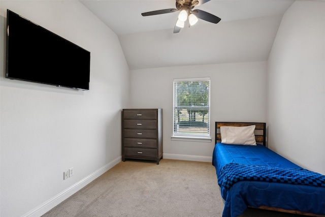 bedroom with ceiling fan, light carpet, and lofted ceiling