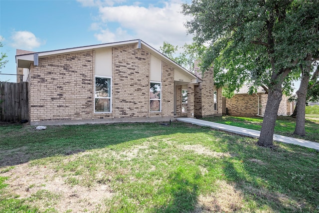 view of side of home featuring a lawn