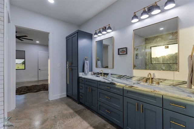 bathroom with vanity, concrete floors, ceiling fan, and a shower with door