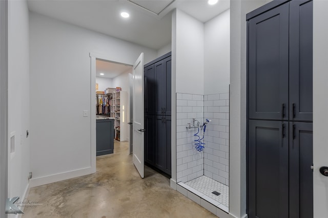 bathroom with concrete floors and a shower