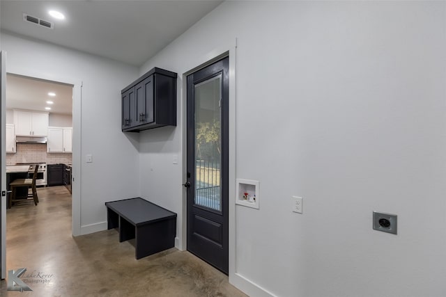 clothes washing area with cabinets, hookup for a washing machine, and electric dryer hookup