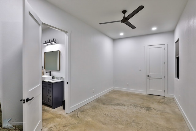 empty room featuring sink and ceiling fan