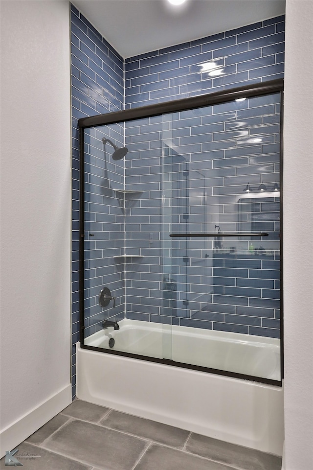 bathroom with tile patterned floors and enclosed tub / shower combo