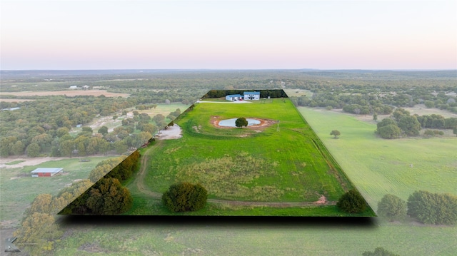 aerial view at dusk featuring a rural view