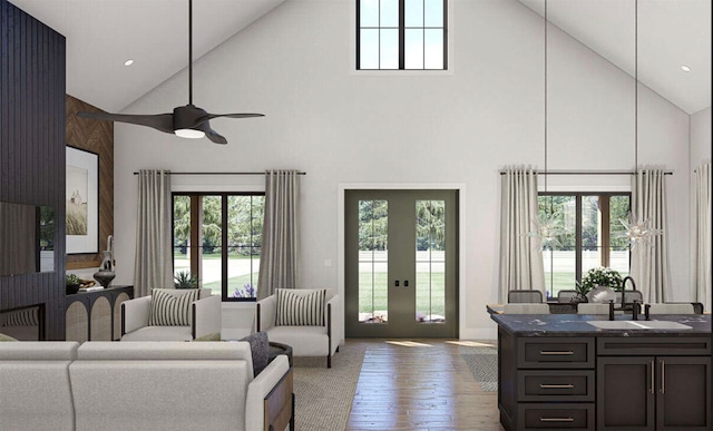 living room with hardwood / wood-style flooring, high vaulted ceiling, sink, and ceiling fan