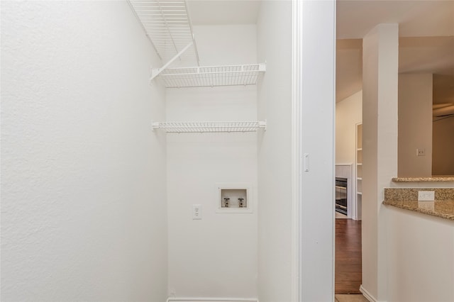 laundry room featuring hardwood / wood-style floors and washer hookup