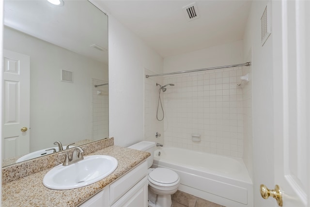 full bathroom with vanity, tiled shower / bath combo, toilet, and tile patterned flooring